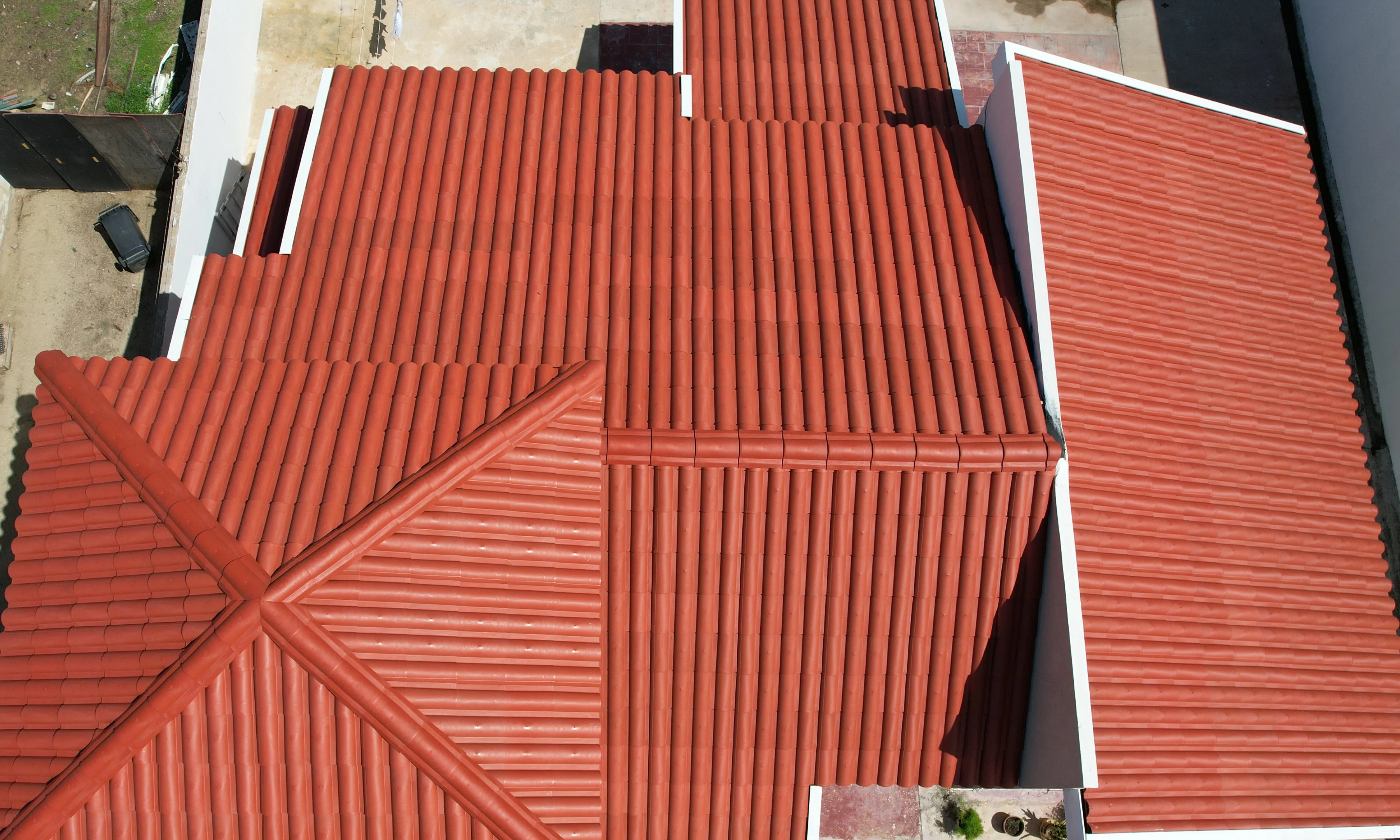 Red clay tile roof of a house seen from above