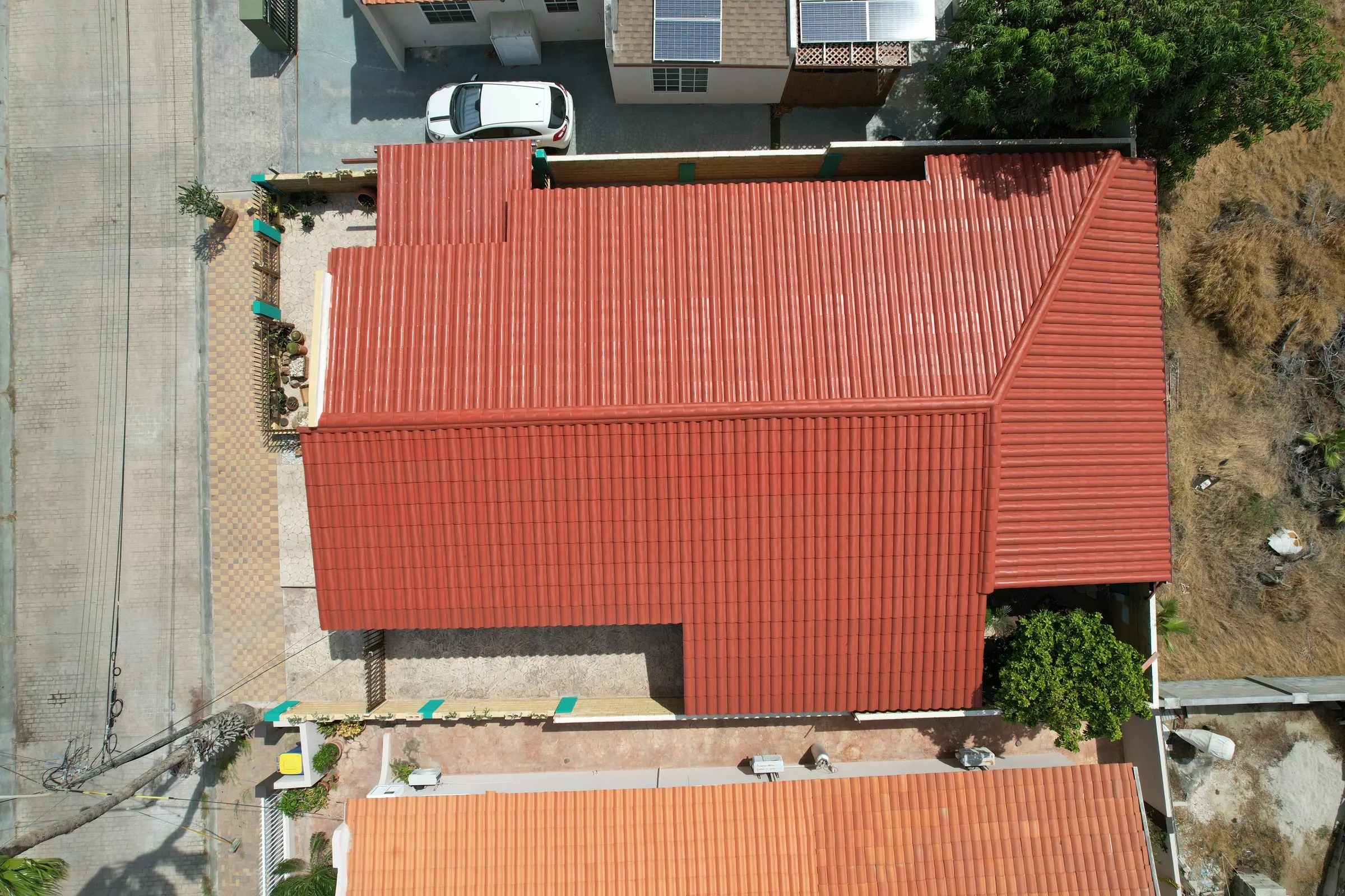 Red clay tile roof of a house seen from above