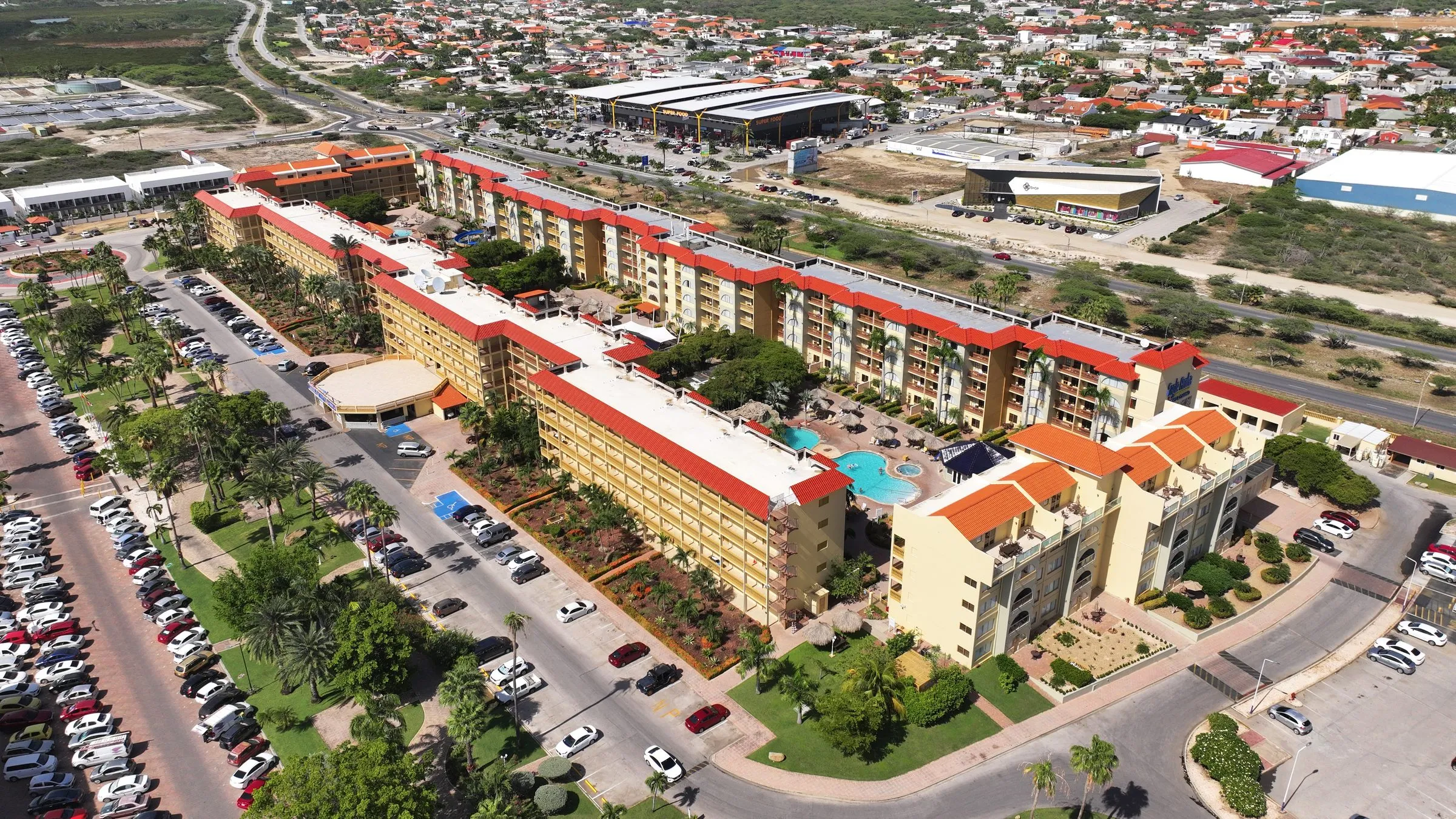 Resort with red tile roofs seen from above